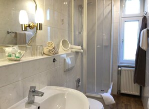 Shower, hair dryer, towels