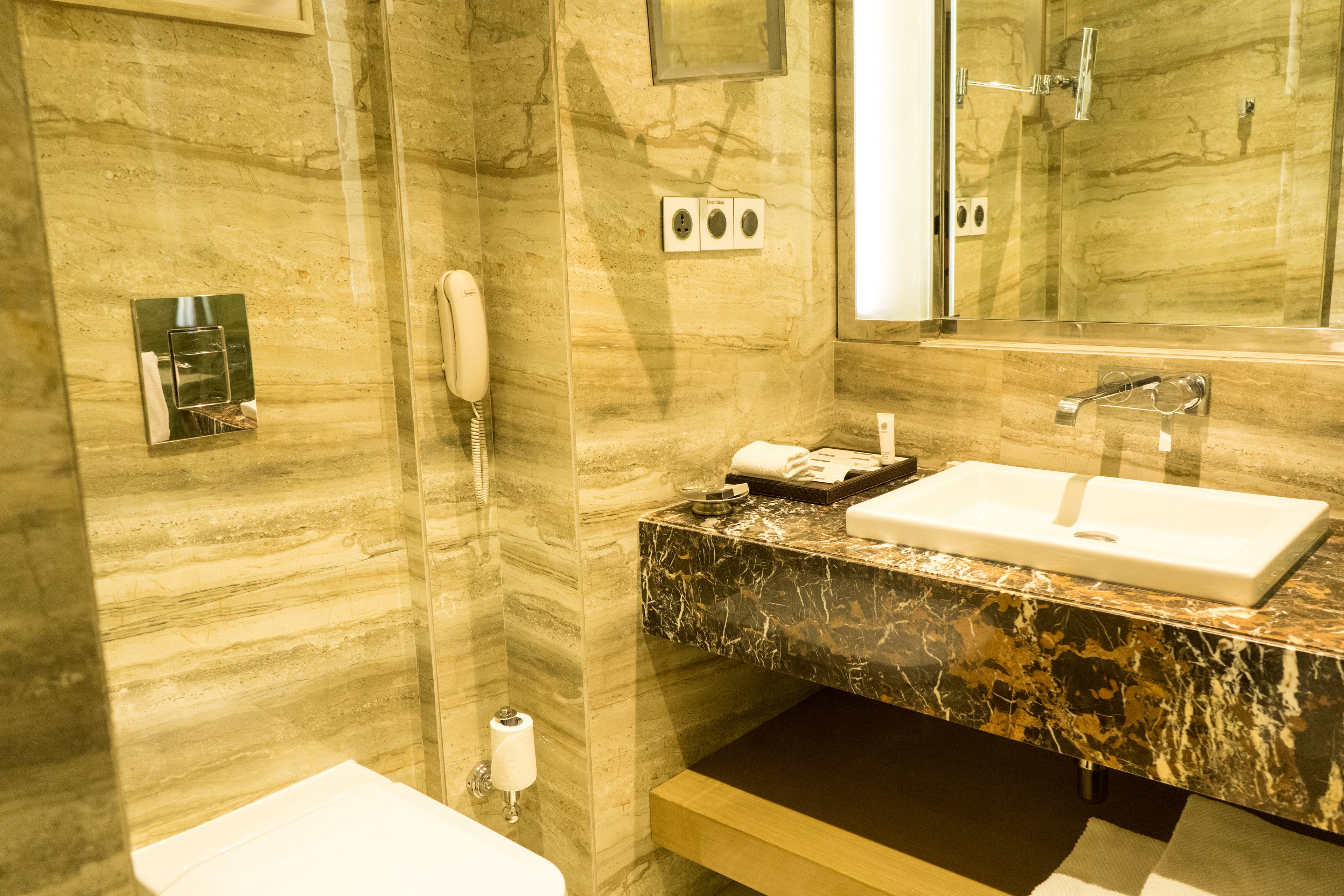 rainfall showerhead, designer toiletries, hair dryer, bathrobes