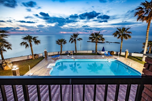 Seasonal outdoor pool, pool umbrellas, pool loungers