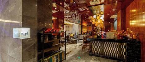 A modern interior with a bar area, marble flooring, and wooden accents.