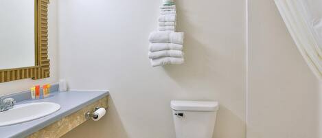 Designer toiletries, hair dryer, bidet, towels