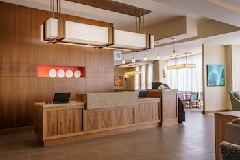 A multi-story hotel with a modern design, featuring a prominent