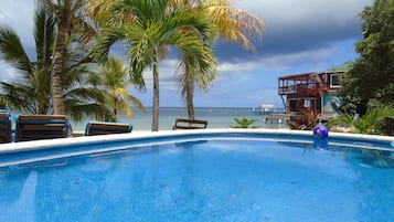 Outdoor pool, open 8 AM to 10 PM, pool loungers