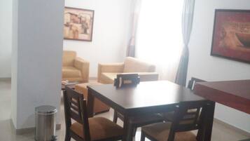 Suite, Balcony | Living area | TV