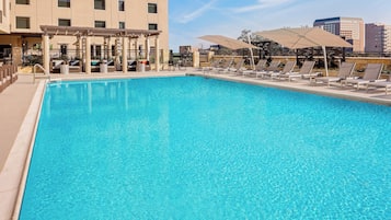 Outdoor pool, open 7:00 AM to 10:00 PM, cabanas (surcharge)