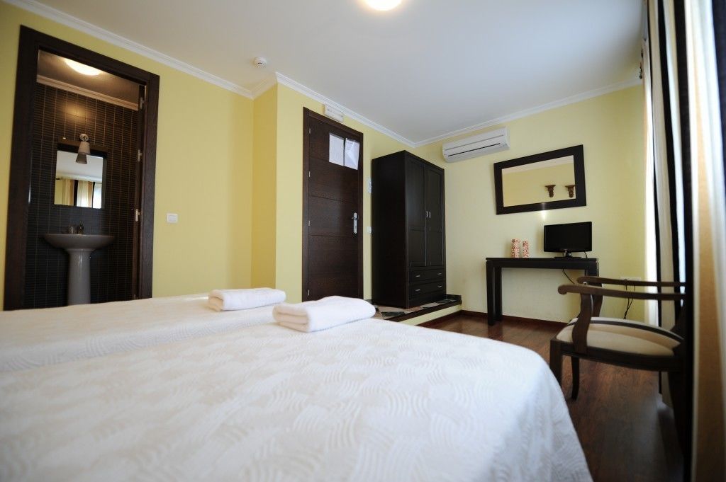 premium bedding, desk, blackout curtains, iron/ironing board