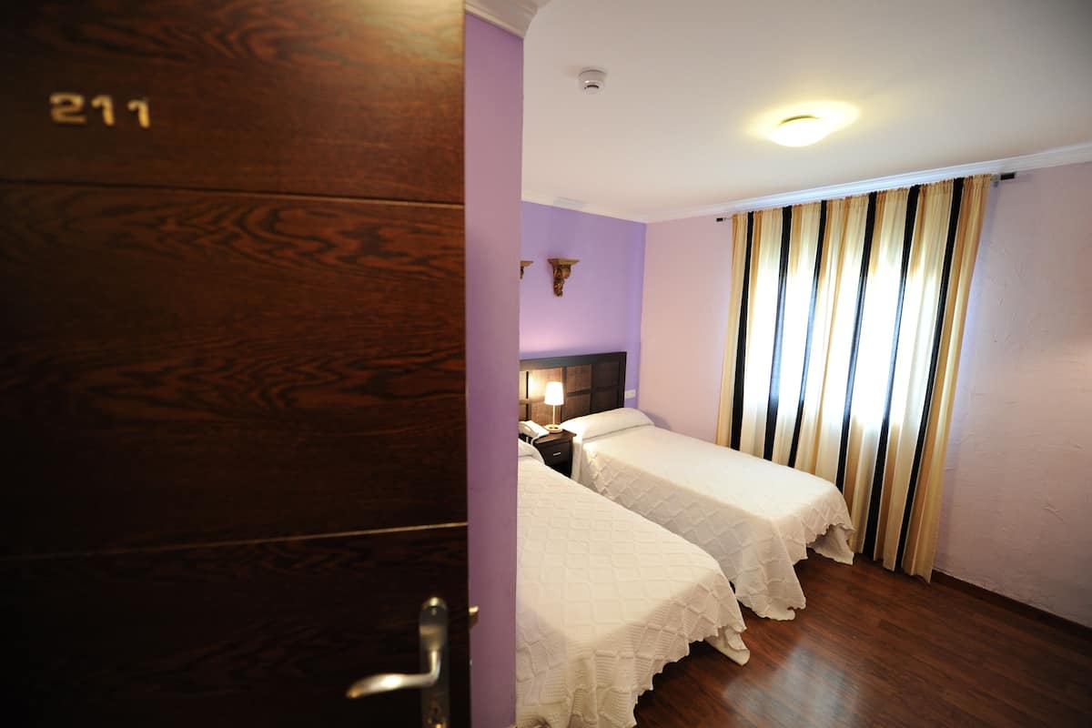 premium bedding, desk, blackout curtains, iron/ironing board