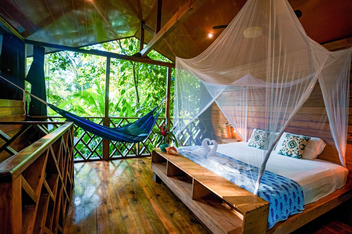 Laptop workspace, bed sheets
