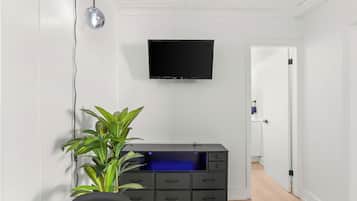 Standard Room, 2 Bedrooms (1 Queen and 1 Double Bed) | Living area | 32-inch flat-screen TV with digital channels, TV