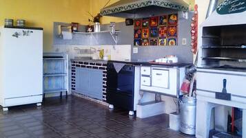 Full-sized fridge, microwave, stovetop, cookware/dishes/utensils