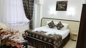 Suíte estúdio | Escrivaninha, berços grátis, camas extras/dobráveis (sobretaxa)