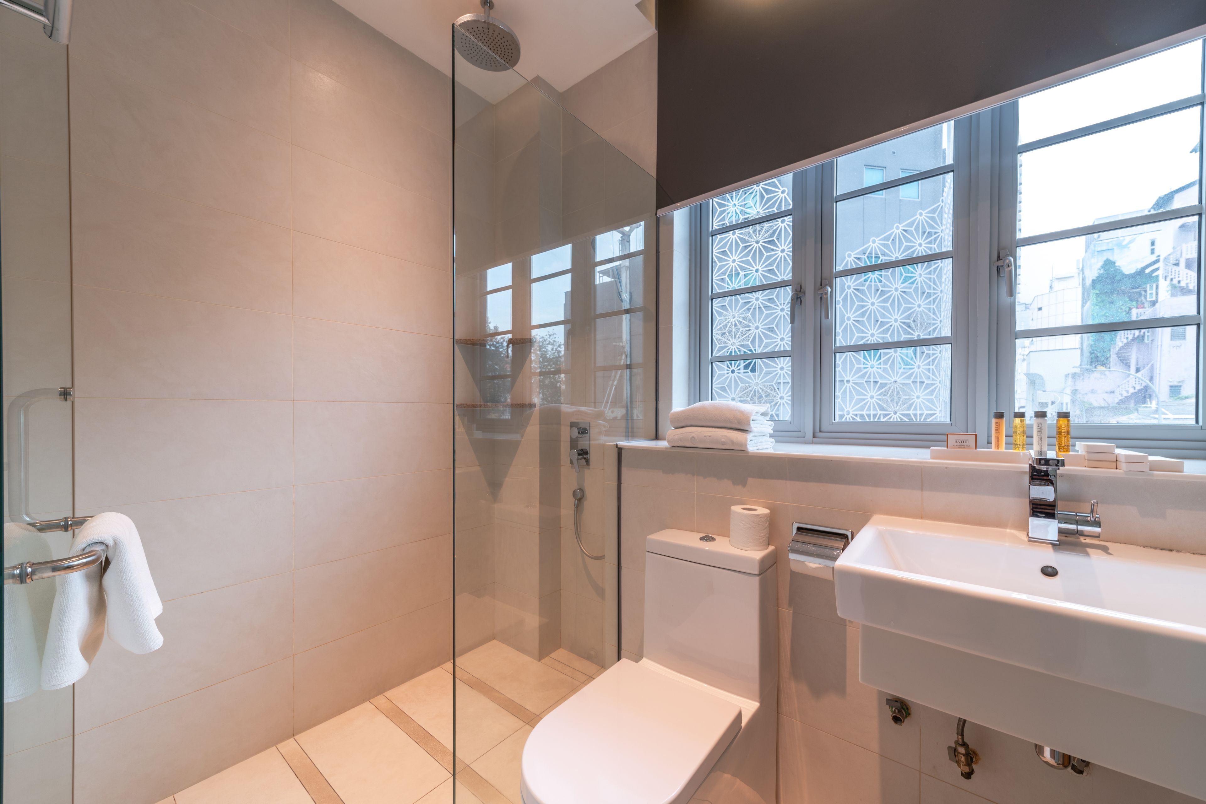 executive twin room | bathroom | free toiletries, hair dryer, slippers, towels