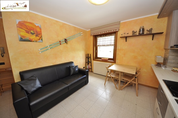 Apartment, 1 Bedroom | Living area | 32-inch flat-screen TV with satellite channels, TV