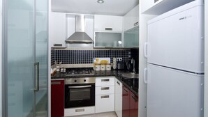 Apartment, 2 Bedrooms | Private kitchen | Full-sized fridge, stovetop, electric kettle, cookware/dishes/utensils - Belek Golf Apartments (Serik)