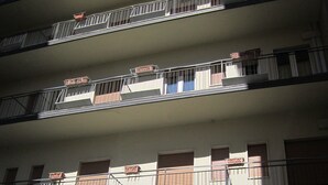 A multi-story building with balconies and a sign that reads "Tourist Hotel". - Tourist Hotel (Potenza)
