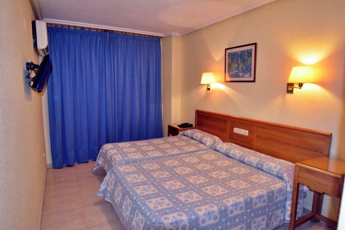Desk, blackout curtains, iron/ironing board (on request)