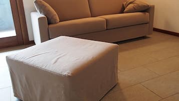 Apartment, 1 Bedroom (Split Level) | Living area | Flat-screen TV