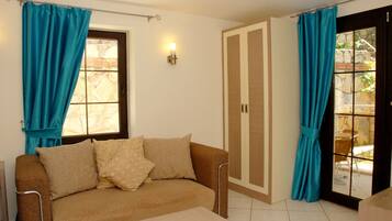 Appartamento, 1 camera da letto | Soggiorno | TV a schermo piatto