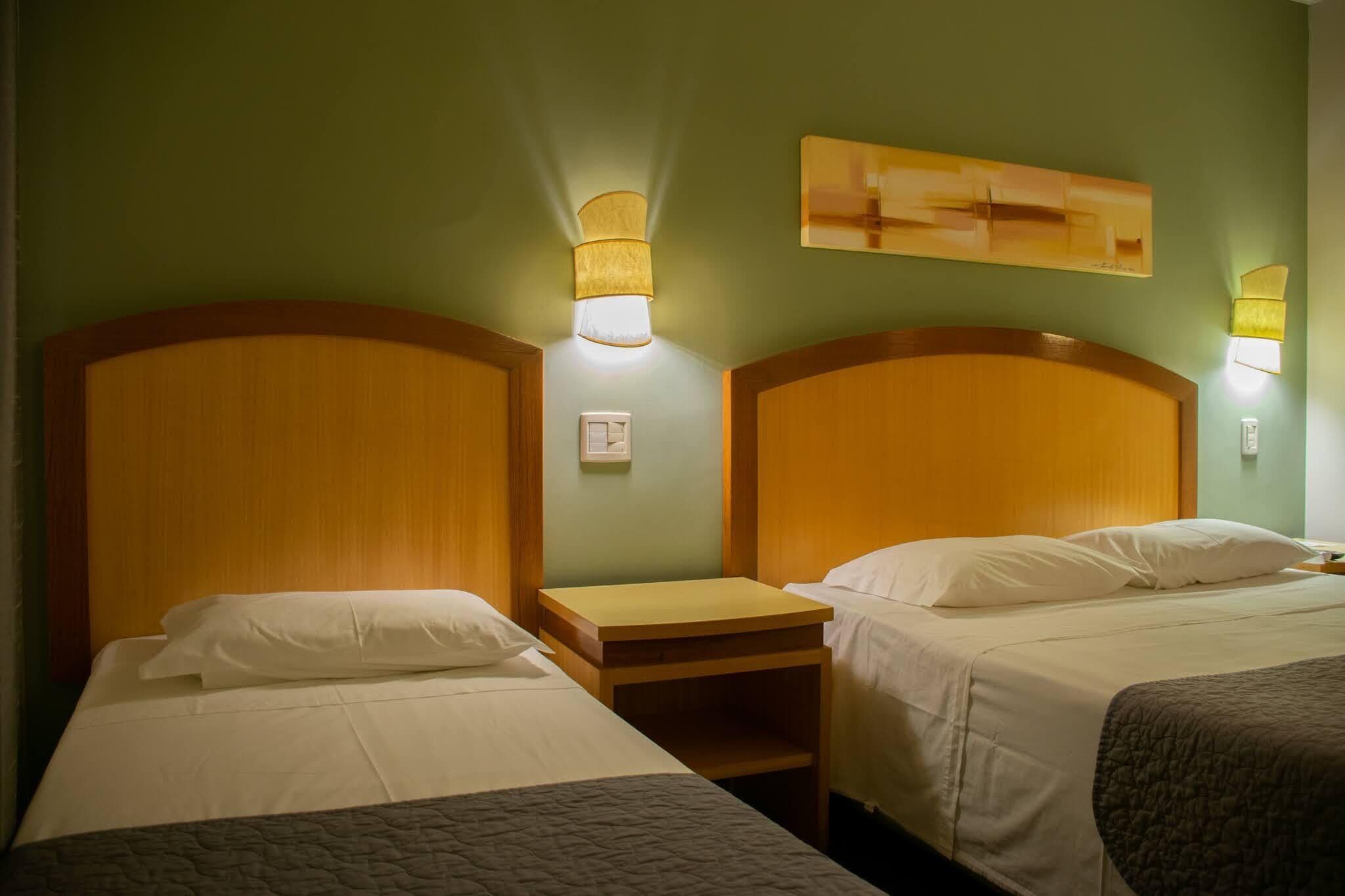 superior triple room | minibar, in-room safe, desk, laptop workspace