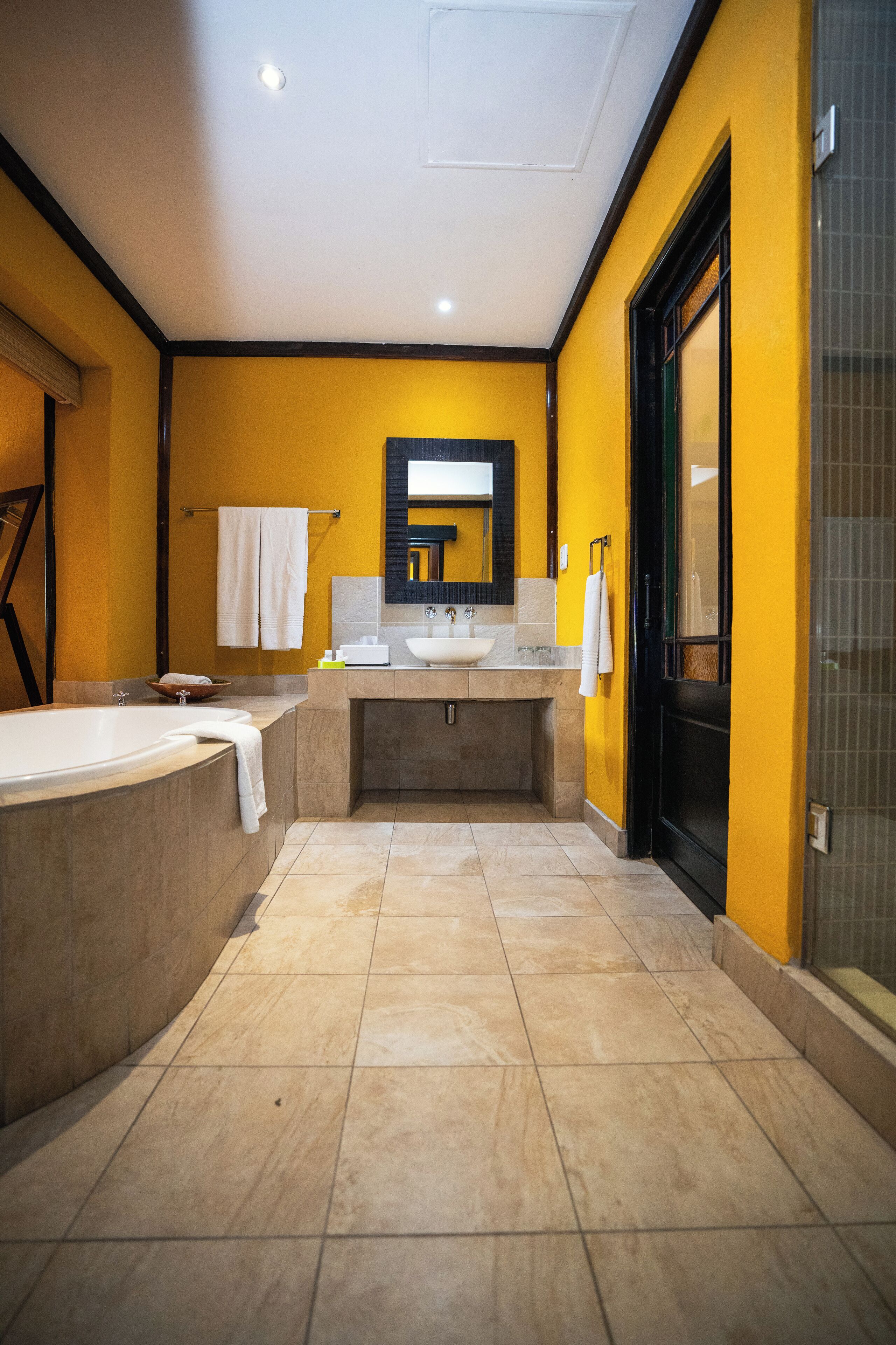 separate bathtub and shower, free toiletries, towels