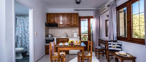 Fridge, coffee/tea maker, electric kettle, cookware/dishes/utensils