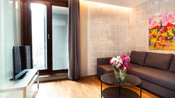 APARTMENT 4, Large 1 Bedroom with Bath | Living area | Flat-screen TV, DVD player