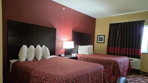 A hotel room with two beds, a nightstand with a lamp, a framed picture on the wall, and a window with curtains. - SureStay Studio By Best Western El Dorado (El Dorado)