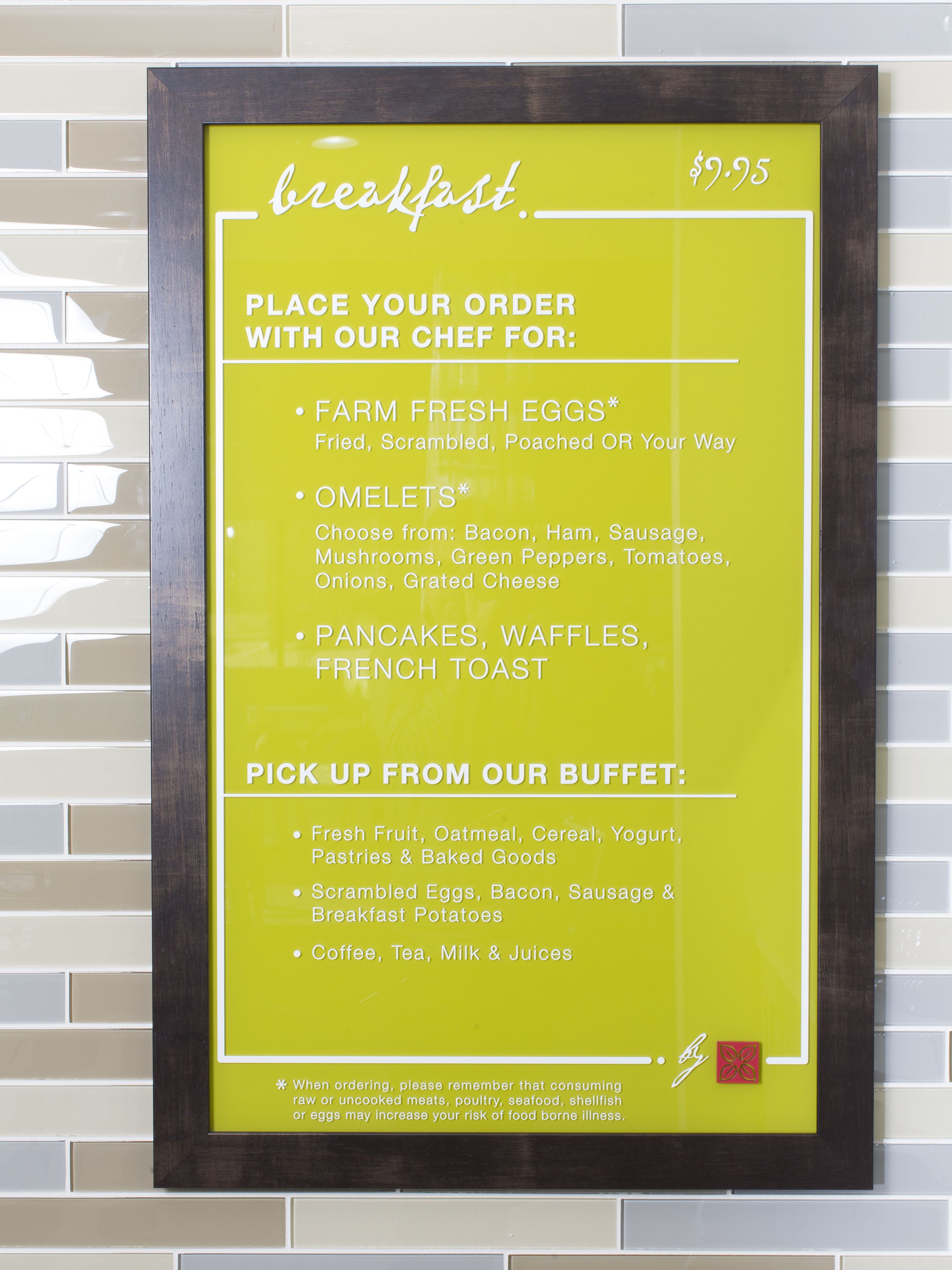 A menu board with breakfast options and prices.