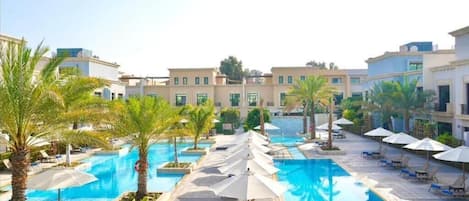 Outdoor pool, open 8:00 AM to 7:00 PM, pool umbrellas, sun loungers