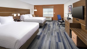A hotel room with two beds, a desk with a TV, a chair, and a large window. - Holiday Inn Express & Suites New Braunfels by IHG (New Braunfels)