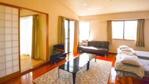 Family Apartment, Multiple Beds, Ocean View | Living area | LCD TV - Resort Mansion Sea Zone (Onna)