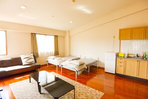 Family Apartment, Multiple Beds, Ocean View | Living area | LCD TV - Resort Mansion Sea Zone (Onna)