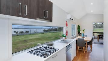 Premium Cabin Ocean View - Sleeps 4 | Private kitchen | Full-size fridge, microwave, stovetop, coffee/tea maker