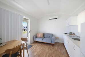 Deluxe Cabin - Sleeps 2 - Dog Friendly | Living area - Reflections Ballina - Holiday Park (Ballina)