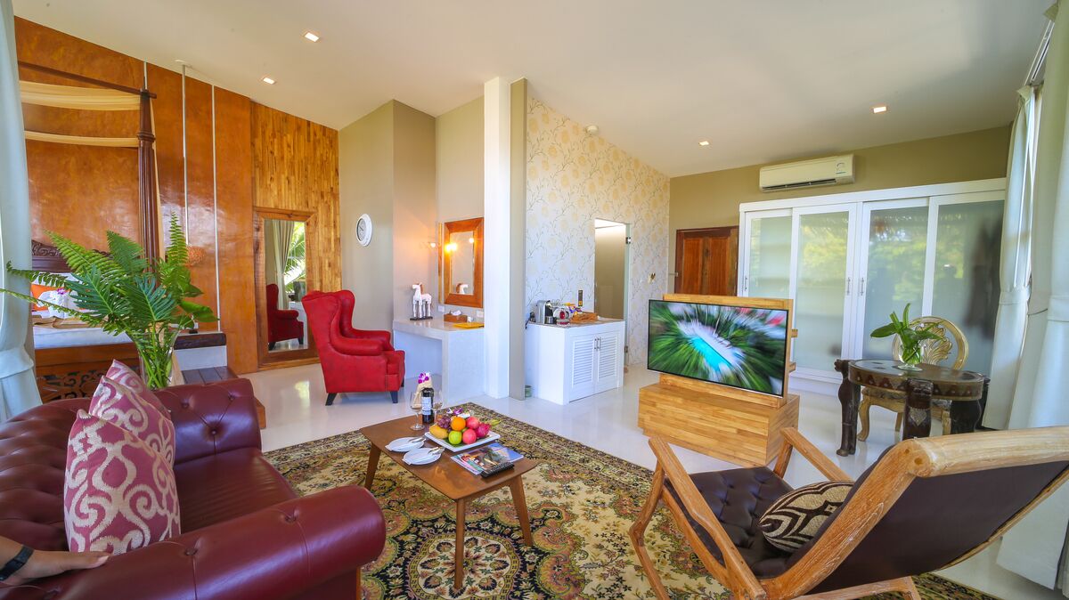 premium ocean suite | living area | 55-inch smart tv with digital channels, netflix, streaming services