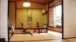 A traditional Japanese room with tatami flooring, a low table, and a tea set. - Ise Todaya Ryoan (Ise)