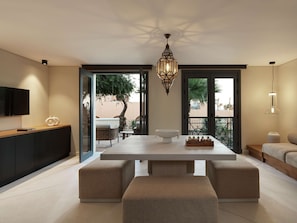 Enjoy meals at the large dining table, flanked by cushioned benches, with a view of palm trees and a building from the adjacent balcony.