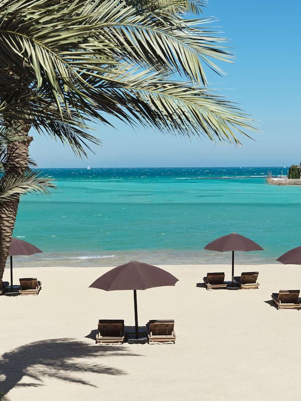 Private beach, beach umbrellas, beach towels, beach volleyball