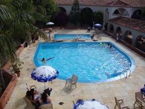 2 outdoor pools, open 9:30 AM to 8:30 PM, pool umbrellas, pool loungers