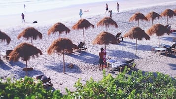 Private beach, beach umbrellas, beach towels, beach yoga