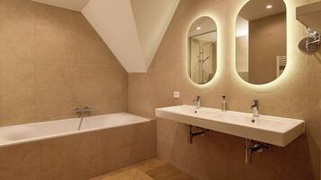 Suite, 1 King Bed | Bathroom | Designer toiletries, hair dryer, towels