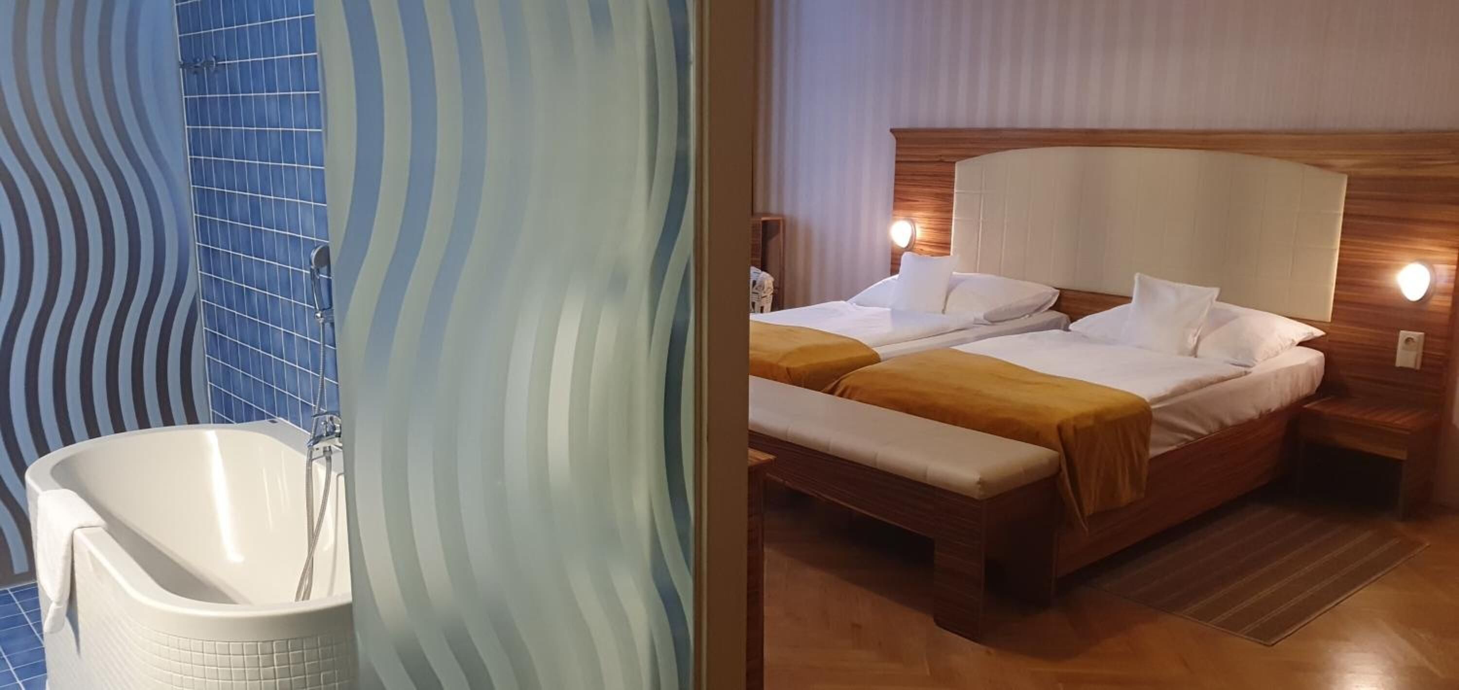 Um banheiro com banheira e chuveiro, e um quarto com duas camas e cabeceira de madeira.