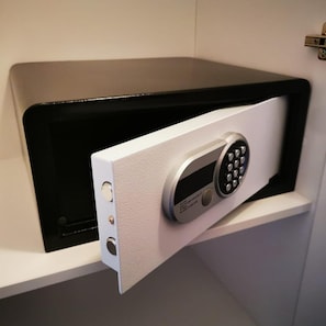 A secure storage unit with a keypad lock, a small display screen, and a USB port.