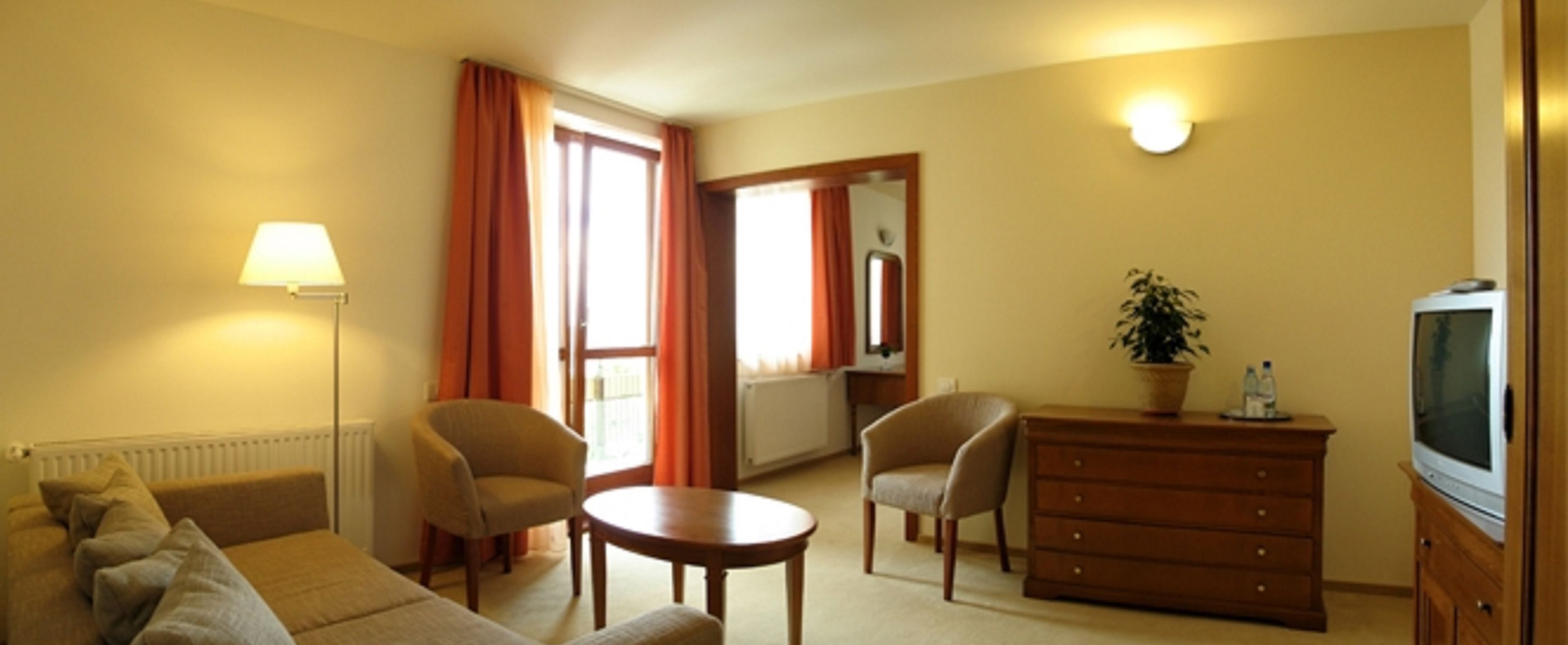 business suite, 2 bedrooms, balcony, city view | living area | flat-screen tv