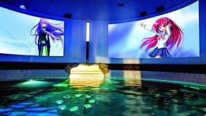 A swimming pool with a tiled floor and a central water feature.