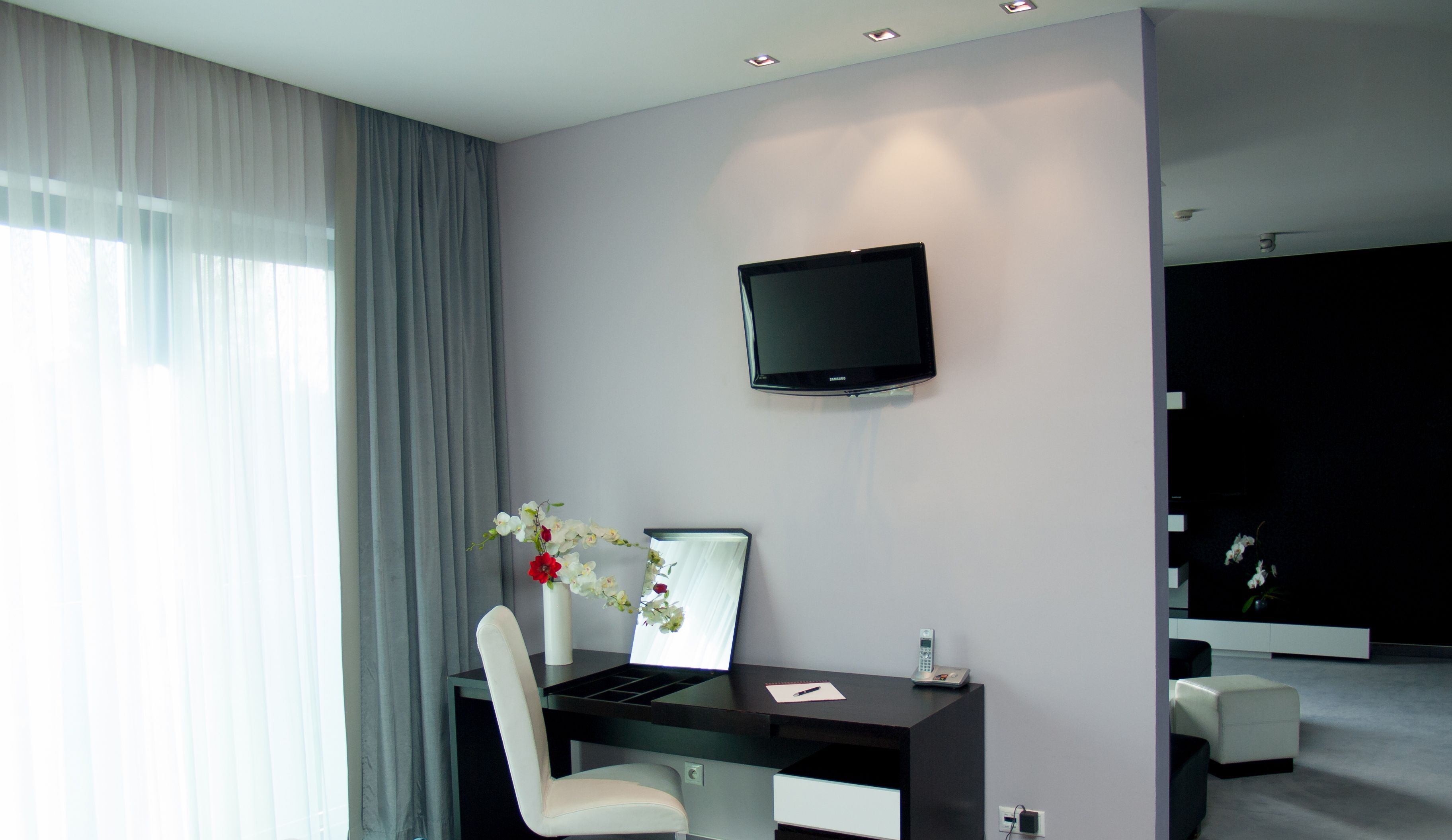 Deluxe-Suite | Wohnbereich | Flachbildfernseher
