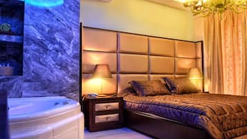 Suite Deluxe | Caja fuerte, cunas gratuitas, wifi gratis y ropa de cama