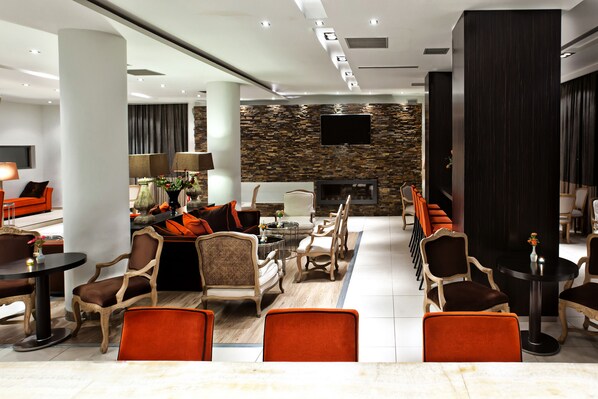 Relax in our spacious lobby with comfortable seating, a flat-screen TV, and a stylish accent wall.