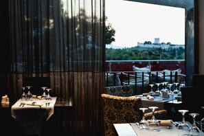 Enjoy a formal dining experience with a view of the historic castle and surrounding landscape.
