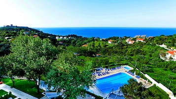 Seasonal outdoor pool, open 11:00 AM to 7:30 PM, pool loungers